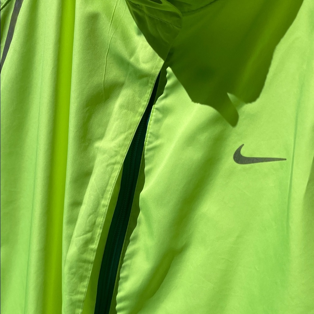 Nike woman’s Bright Lime storm fit Windbreaker